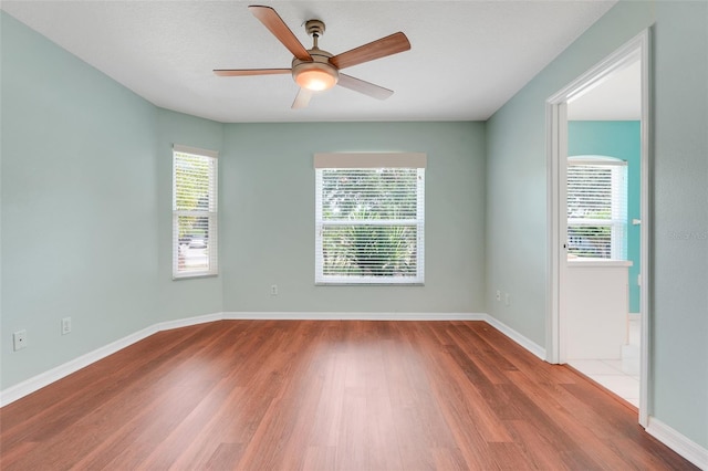 8709 Augusta Ct, Clermont, FL 34711 - unfurnished room featuring baseboards, ceiling fan, and wood finished floors