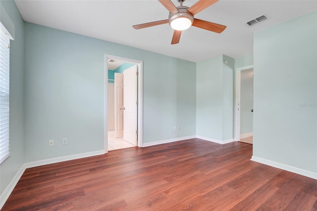 8709 Augusta Ct, Clermont, FL 34711 - spare room featuring baseboards, ceiling fan, wood finished floors, and visible vents