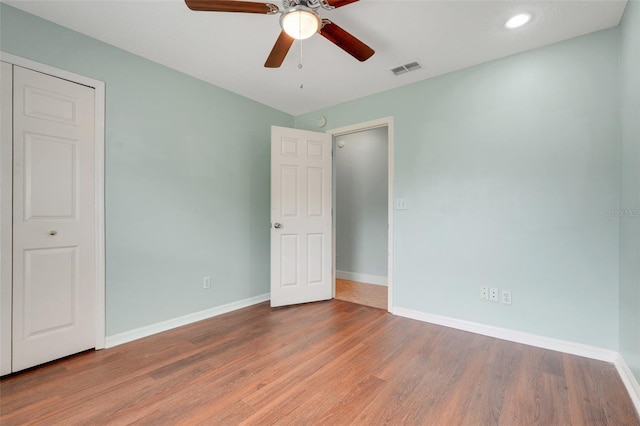 8709 Augusta Ct, Clermont, FL 34711 - unfurnished bedroom with ceiling fan, visible vents, wood finished floors, baseboards, and recessed lighting