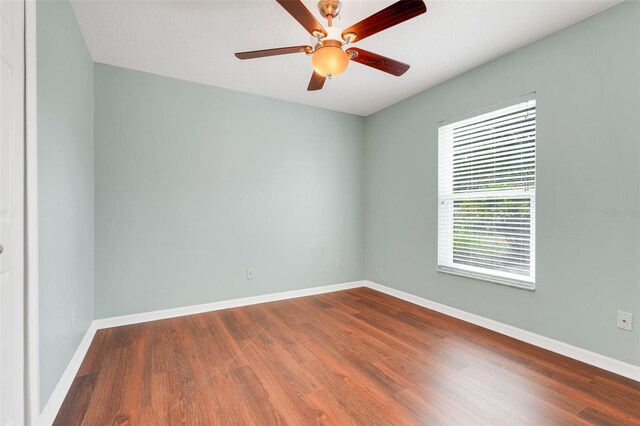 8709 Augusta Ct, Clermont, FL 34711 - empty room with baseboards, a ceiling fan, and wood finished floors