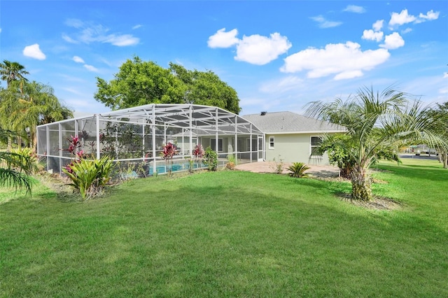 8709 Augusta Ct, Clermont, FL 34711 - rear view of house featuring a yard, a patio, an outdoor pool, and glass enclosure
