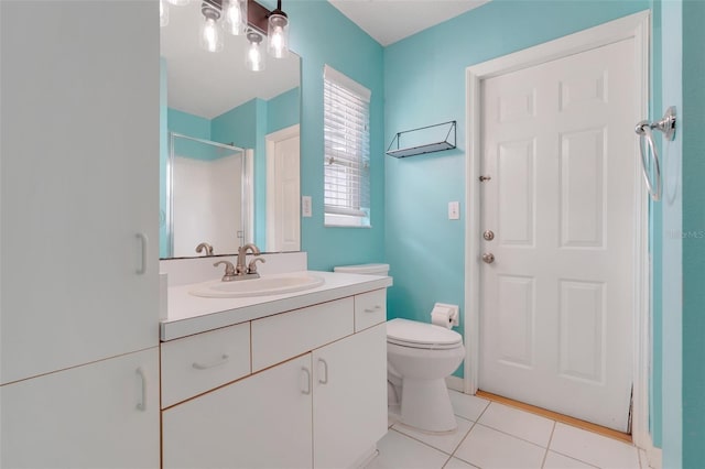 8709 Augusta Ct, Clermont, FL 34711 - bathroom with vanity, tile patterned floors, a stall shower, and toilet