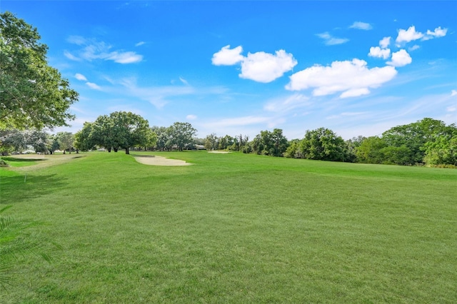 8709 Augusta Ct, Clermont, FL 34711 - surrounding community featuring a lawn and view of golf course