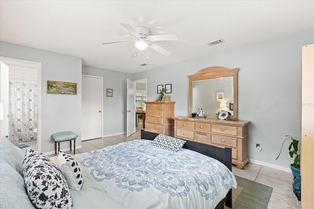 bedroom with visible vents, a ceiling fan, baseboards, and light tile patterned floors