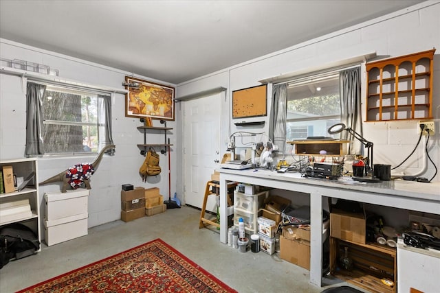 interior space with plenty of natural light and concrete flooring