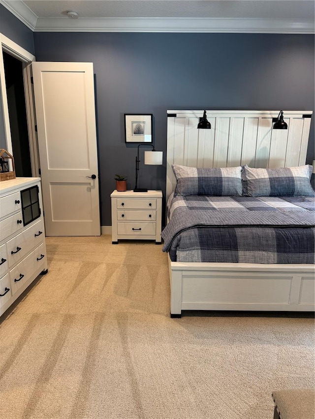 bedroom with light carpet and crown molding