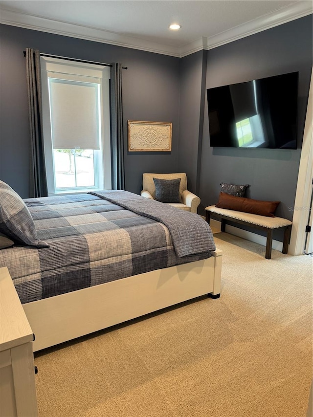 carpeted bedroom featuring ornamental molding and recessed lighting