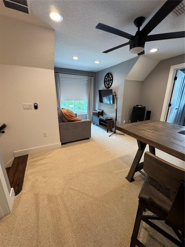 interior space with a ceiling fan, a textured ceiling, recessed lighting, and baseboards