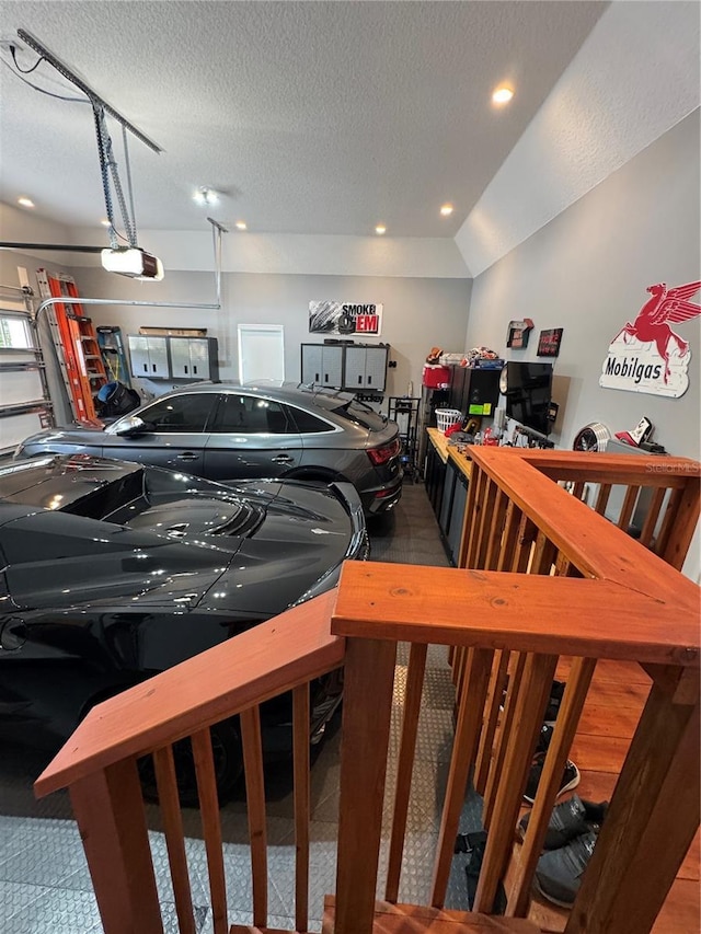 garage featuring a garage door opener and recessed lighting