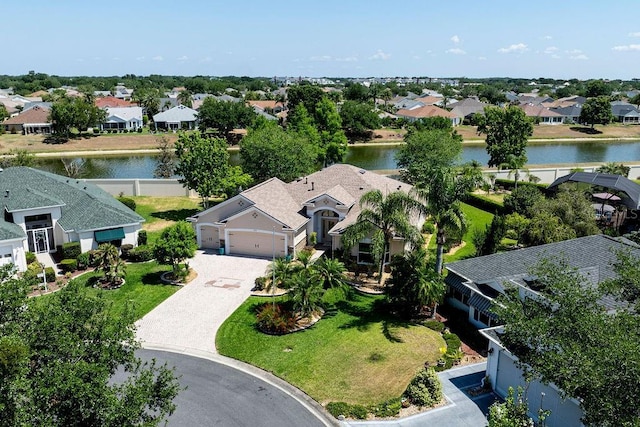 bird's eye view with a water view and a residential view