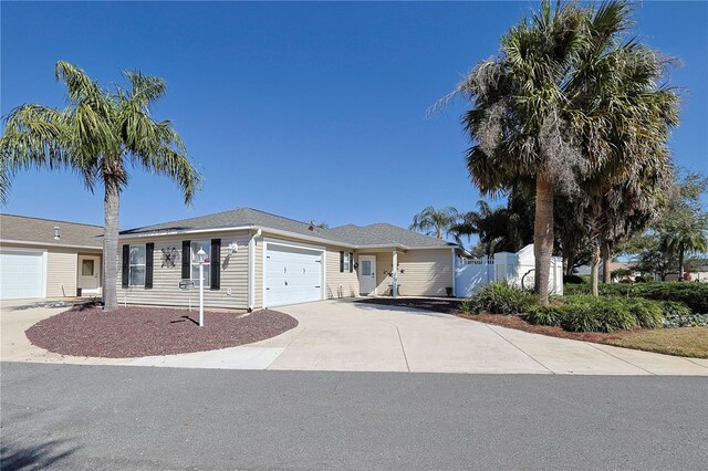 1451 Rosedale Way, The Villages, FL 32162 - single story home with fence, driveway, and a garage