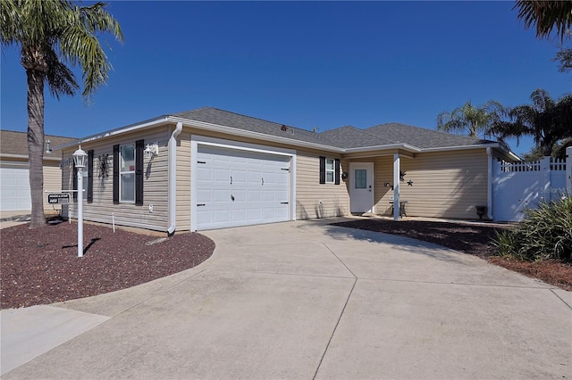 1451 Rosedale Way, The Villages, FL 32162 - ranch-style house with a garage, fence, and driveway