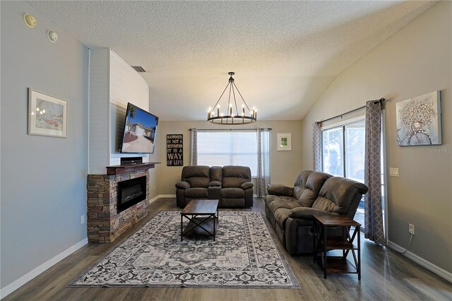 1451 Rosedale Way, The Villages, FL 32162 - living area featuring dark wood-style flooring, a textured ceiling, a chandelier, baseboards, and visible vents