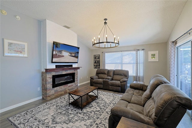 1451 Rosedale Way, The Villages, FL 32162 - living area with an inviting chandelier, lofted ceiling, wood finished floors, a fireplace, and baseboards