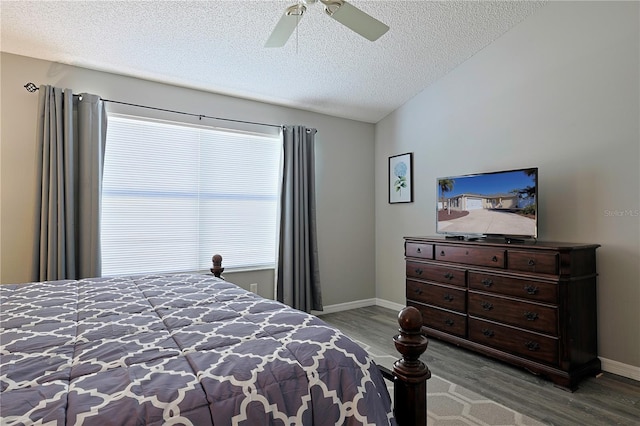 1451 Rosedale Way, The Villages, FL 32162 - bedroom featuring baseboards, ceiling fan, a textured ceiling, and wood finished floors
