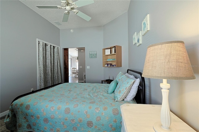 1451 Rosedale Way, The Villages, FL 32162 - bedroom with a ceiling fan, a textured ceiling, and lofted ceiling