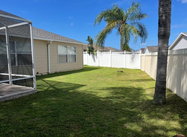 1451 Rosedale Way, The Villages, FL 32162 - view of yard featuring a fenced backyard and glass enclosure