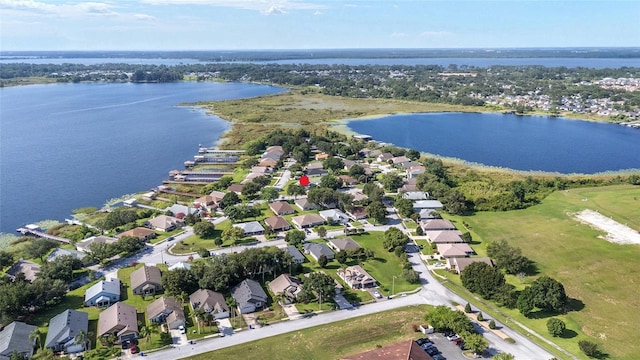 2750 Coral Reef Way, Tavares, FL 32778 - aerial view of property and surrounding area with nearby suburban area and a large body of water