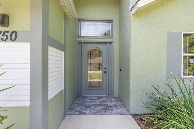 2750 Coral Reef Way, Tavares, FL 32778 - entrance to property with stucco siding