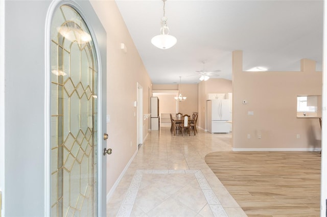 2750 Coral Reef Way, Tavares, FL 32778 - foyer entrance with inlaid floor details, light tile patterned floors, and a ceiling fan