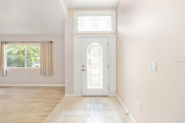 2750 Coral Reef Way, Tavares, FL 32778 - entrance foyer with a textured wall and light tile patterned floors