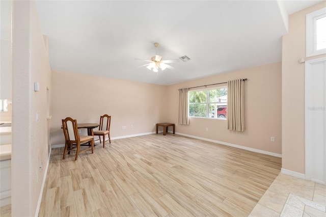 2750 Coral Reef Way, Tavares, FL 32778 - sitting room with a ceiling fan and light wood-style floors