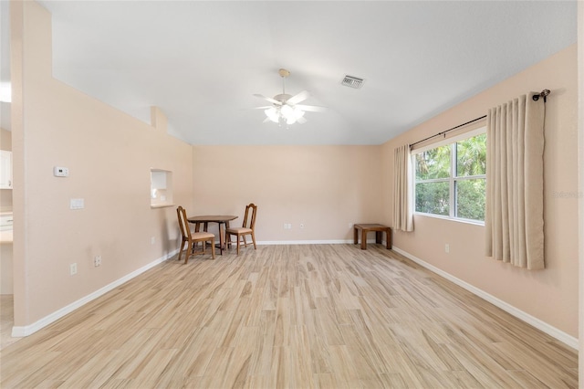 2750 Coral Reef Way, Tavares, FL 32778 - unfurnished room featuring lofted ceiling, ceiling fan, and light wood-style floors