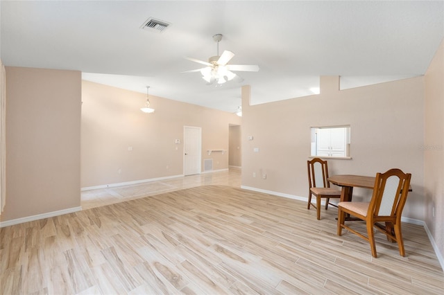 2750 Coral Reef Way, Tavares, FL 32778 - unfurnished room featuring lofted ceiling, ceiling fan, and light wood-style flooring