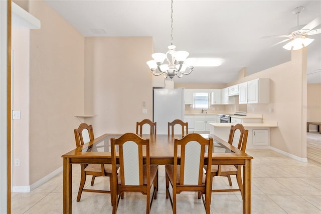 2750 Coral Reef Way, Tavares, FL 32778 - dining area featuring light tile patterned floors, a chandelier, and a ceiling fan