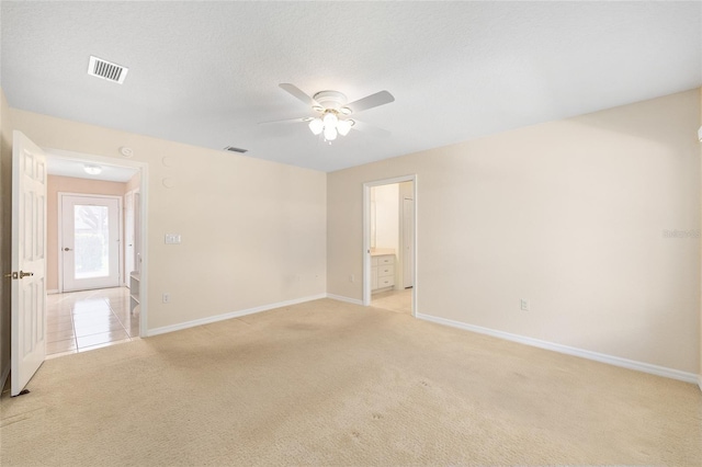2750 Coral Reef Way, Tavares, FL 32778 - unfurnished room featuring light carpet and a ceiling fan