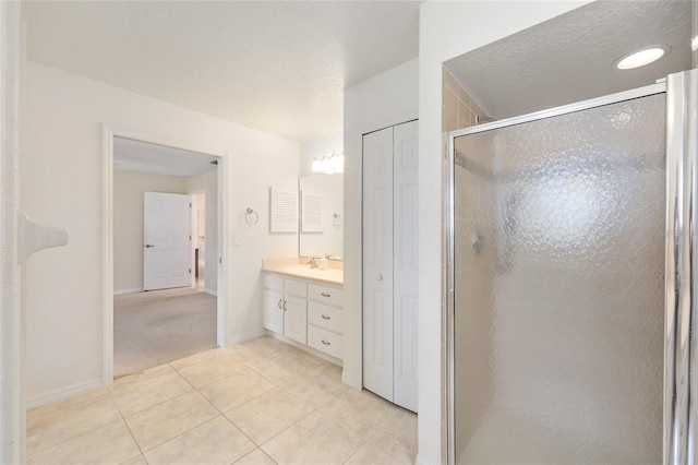 2750 Coral Reef Way, Tavares, FL 32778 - full bath featuring vanity, a shower stall, tile patterned flooring, and a textured ceiling