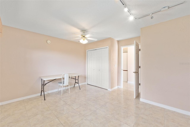2750 Coral Reef Way, Tavares, FL 32778 - empty room featuring ceiling fan, light tile patterned floors, rail lighting, and a smoke detector