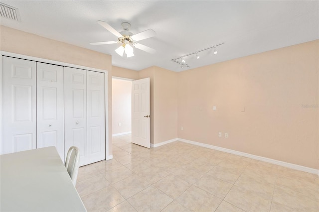 2750 Coral Reef Way, Tavares, FL 32778 - unfurnished office featuring ceiling fan, light tile patterned flooring, and rail lighting