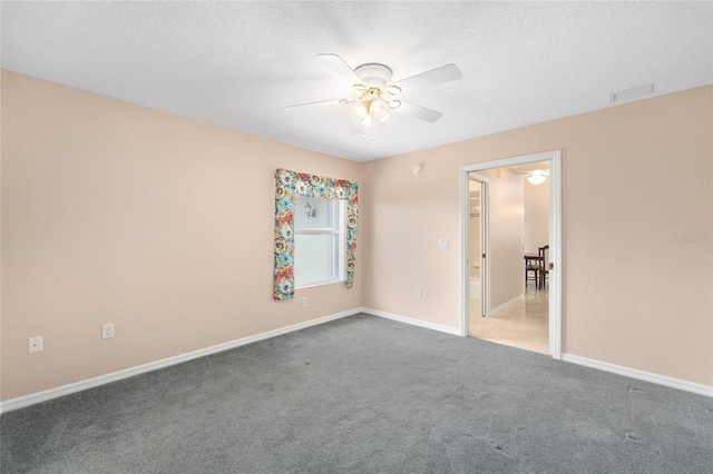 2750 Coral Reef Way, Tavares, FL 32778 - unfurnished room featuring a ceiling fan, carpet, and a textured ceiling