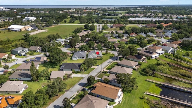 2750 Coral Reef Way, Tavares, FL 32778 - aerial view of property and surrounding area with nearby suburban area and a large body of water