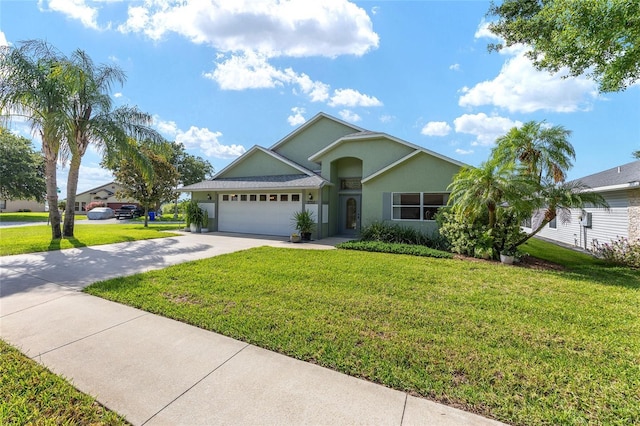 2750 Coral Reef Way, Tavares, FL 32778 - single story home with stucco siding, driveway, an attached garage, and a front lawn