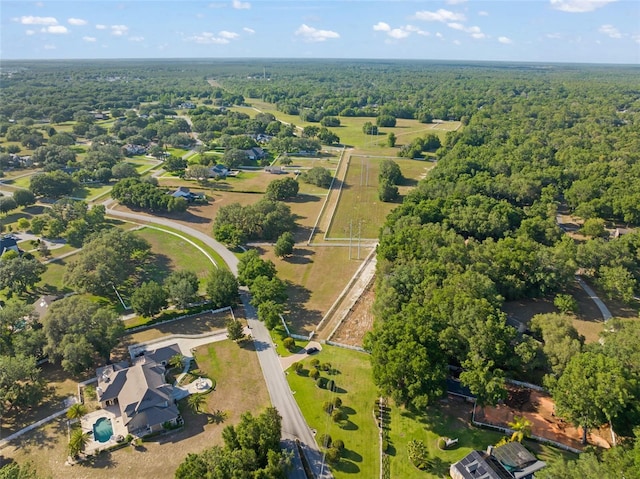 aerial view featuring a wooded view