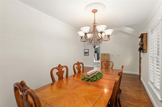 dining space featuring an inviting chandelier, ornamental molding, and baseboards