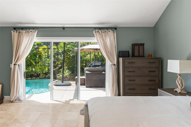 bedroom featuring access to exterior and tile patterned flooring