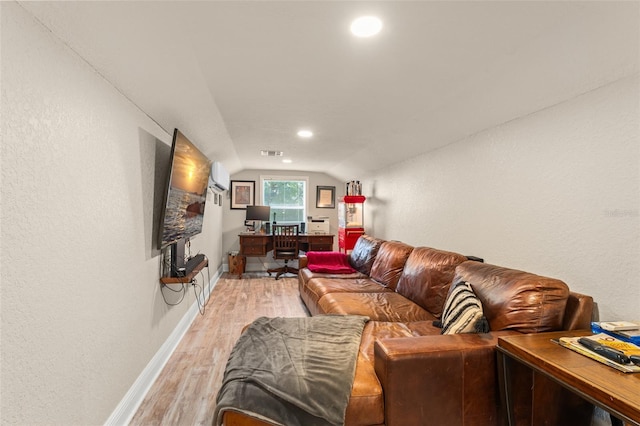 living area featuring visible vents, lofted ceiling, baseboards, light wood-type flooring, and recessed lighting