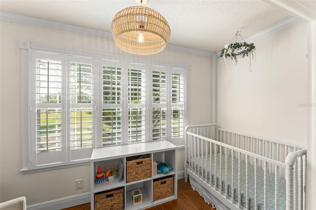 bedroom with ornamental molding, an inviting chandelier, multiple windows, and wood finished floors