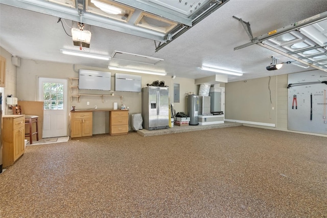 garage featuring electric water heater, a garage door opener, electric panel, and stainless steel fridge with ice dispenser
