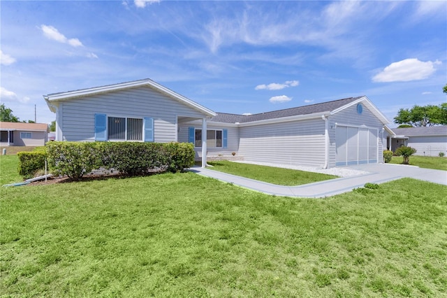 single story home featuring concrete driveway, a front yard, and a garage