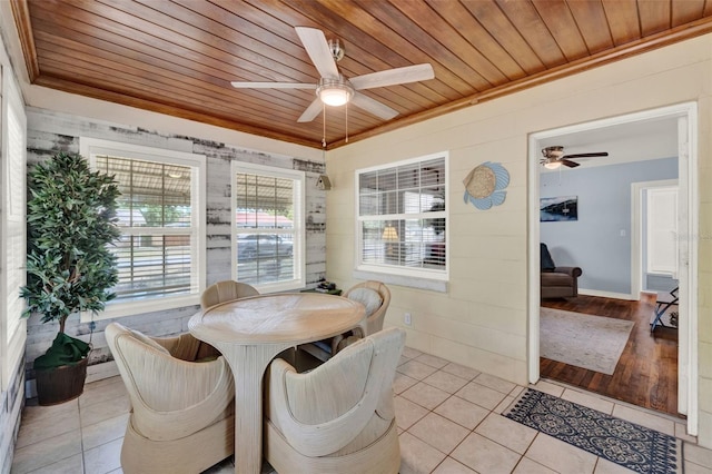 506 Richard St, Leesburg, FL 34748 - dining room featuring crown molding, a ceiling fan, wood ceiling, and light tile patterned floors
