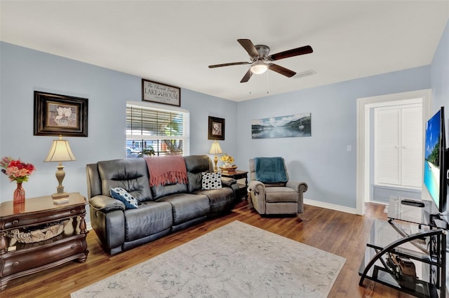 506 Richard St, Leesburg, FL 34748 - living area featuring a ceiling fan, wood finished floors, and baseboards