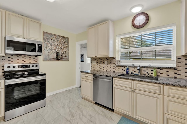 506 Richard St, Leesburg, FL 34748 - kitchen featuring cream cabinets, stainless steel appliances, a sink, light marble finish flooring, and decorative backsplash