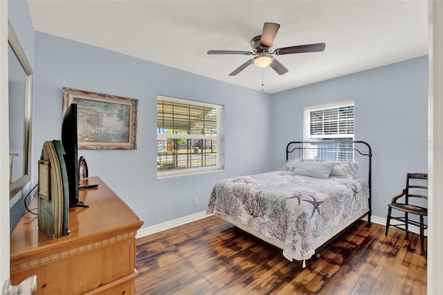 506 Richard St, Leesburg, FL 34748 - bedroom with multiple windows, baseboards, and wood finished floors