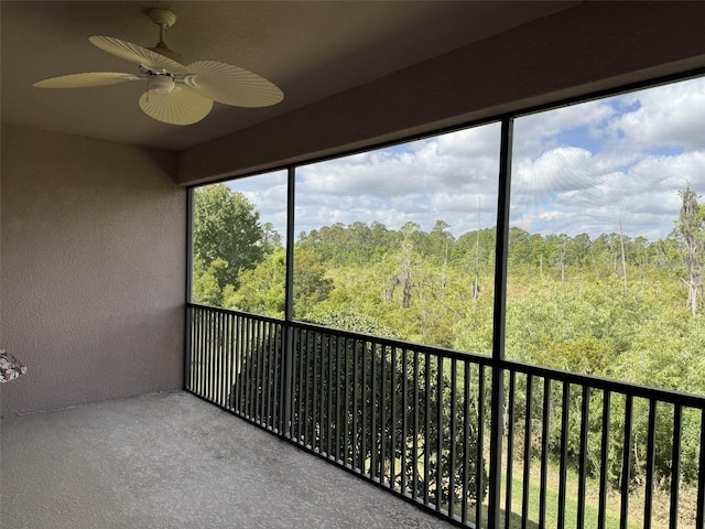1288 Grady Ln, Davenport, FL 33896 - unfurnished sunroom with a wooded view