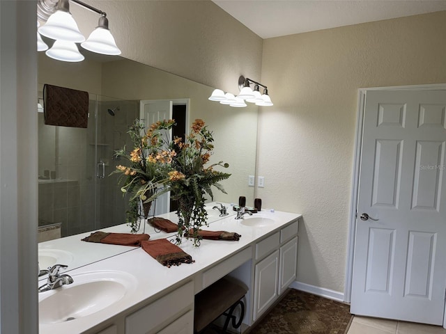 1288 Grady Ln, Davenport, FL 33896 - bathroom with a stall shower, double vanity, a textured wall, and tile patterned flooring