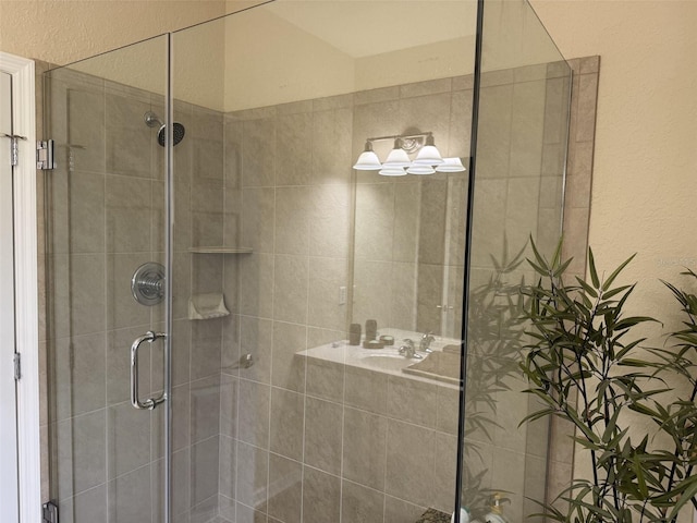 1288 Grady Ln, Davenport, FL 33896 - bathroom featuring a stall shower and a textured wall